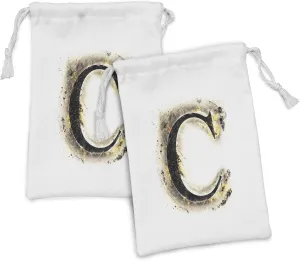 Ambesonne Letter C Fabric Pouch Set of 2, Letter C Backdrop Combusted Alphabet Paper Effect Writing, Small Drawstring Bag for Toiletries Masks and Favors, 9" x 6", Tan Black Yellow
